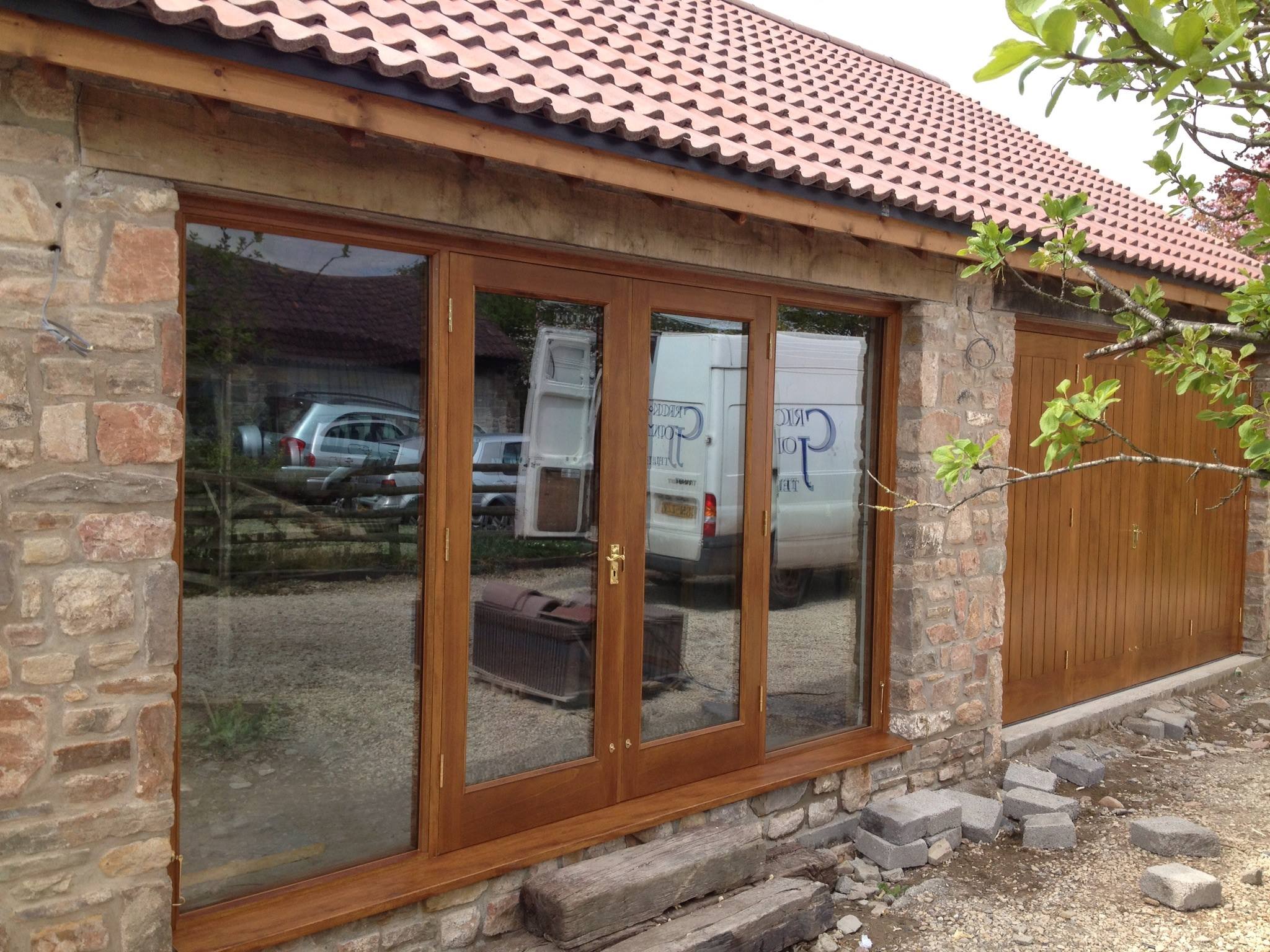 Oak glazed doors fitted to a stone garden room